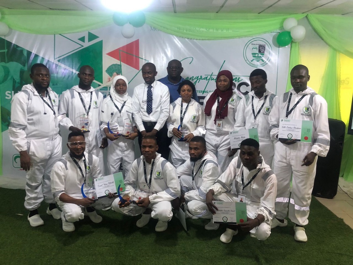 A cross-section of the graduants in a group photograph with Professor Abiodun Musa Aibinu at the Momas Metering School Printed Circuit Board (PCB) design and fabrication graduation programme