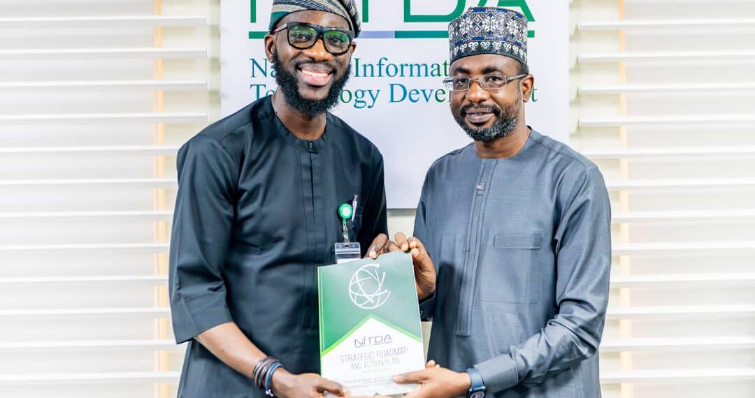 Google West Africa Director, Olumide Balogun, and the Director General, National Information Technology Development Agency (NITDA), Kashifu Inuwa, CCIE, while presenting the former with NITDA'S Strategic RoadMap and Action Plan (SRAP) document, during a visit to NITDA'S corporate headquarters, in Abuja