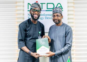 Google West Africa Director, Olumide Balogun, and the Director General, National Information Technology Development Agency (NITDA), Kashifu Inuwa, CCIE, while presenting the former with NITDA'S Strategic RoadMap and Action Plan (SRAP) document, during a visit to NITDA'S corporate headquarters, in Abuja