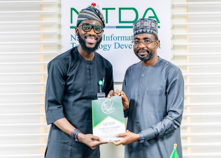 Google West Africa Director, Olumide Balogun, and the Director General, National Information Technology Development Agency (NITDA), Kashifu Inuwa, CCIE, while presenting the former with NITDA'S Strategic RoadMap and Action Plan (SRAP) document, during a visit to NITDA'S corporate headquarters, in Abuja