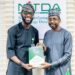 Google West Africa Director, Olumide Balogun, and the Director General, National Information Technology Development Agency (NITDA), Kashifu Inuwa, CCIE, while presenting the former with NITDA'S Strategic RoadMap and Action Plan (SRAP) document, during a visit to NITDA'S corporate headquarters, in Abuja