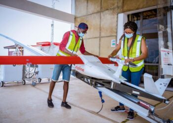 Zipline team preparing parcel for delivery