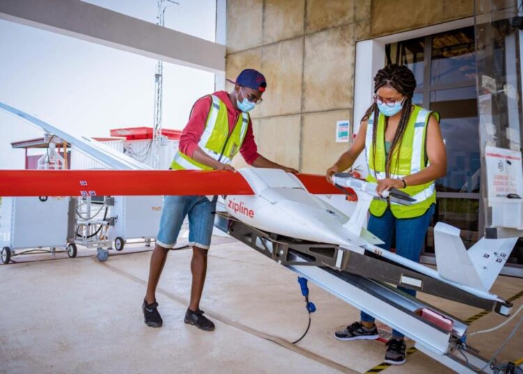 Zipline team preparing parcel for delivery