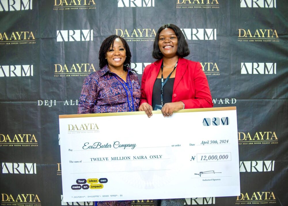 The winner of DAAYTA 2024, Rita Idehai of EcoBarter with Uche Azubuike, MD of ARM Academy