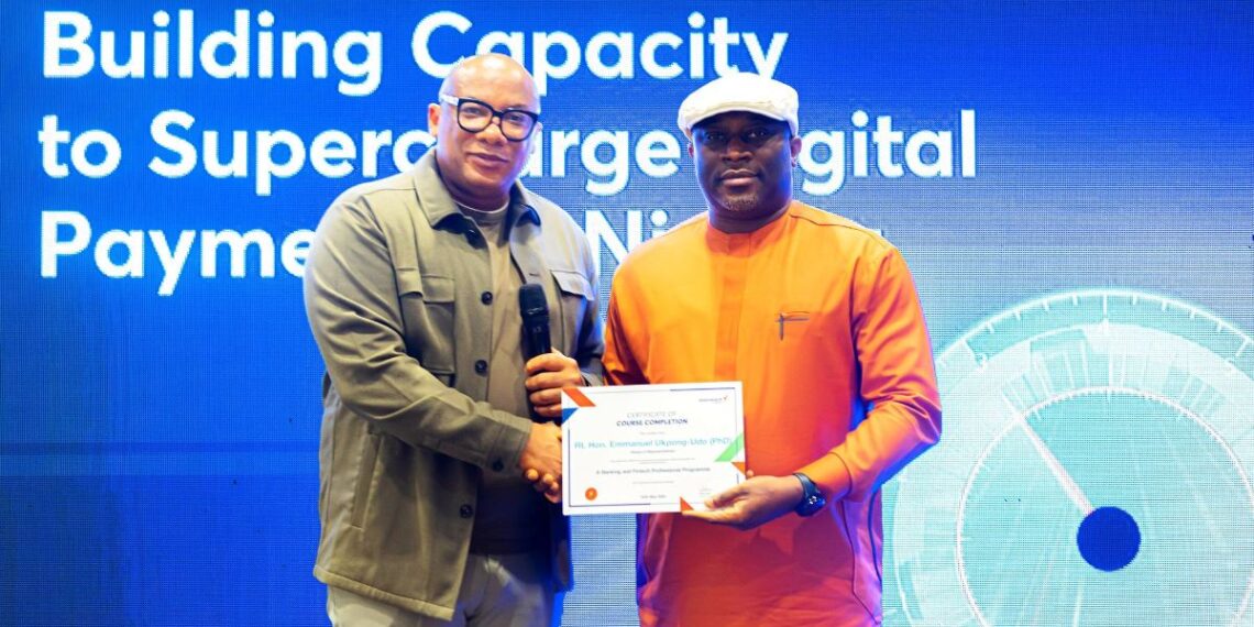 Mitchell Presents Certificate of Participation at the Interswitch training for HoR members