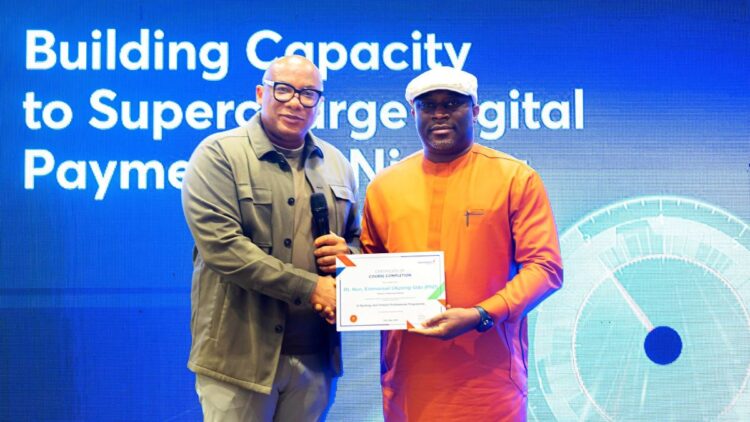 Mitchell Presents Certificate of Participation at the Interswitch training for HoR members