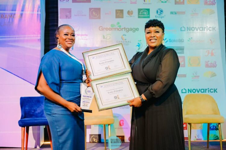 Linda Ochugbua, digital sales manager, BusinessDay (left) receiving the award.