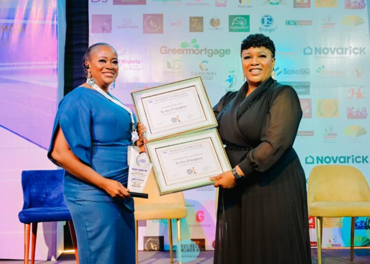 Linda Ochugbua, digital sales manager, BusinessDay (left) receiving the award.