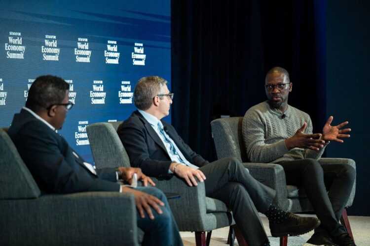 L-r: Yinka Adegoke, Africa Editor at Semafor; John Caplan, CEO and Director of Payoneer; and Olugbenga “GB” Agboola, Founder and CEO, Flutterwave, speaking on the main stage of Semafor’s annual World Economic Summit in Washington, D.C. Credit Kris Triplaar/Semafor.