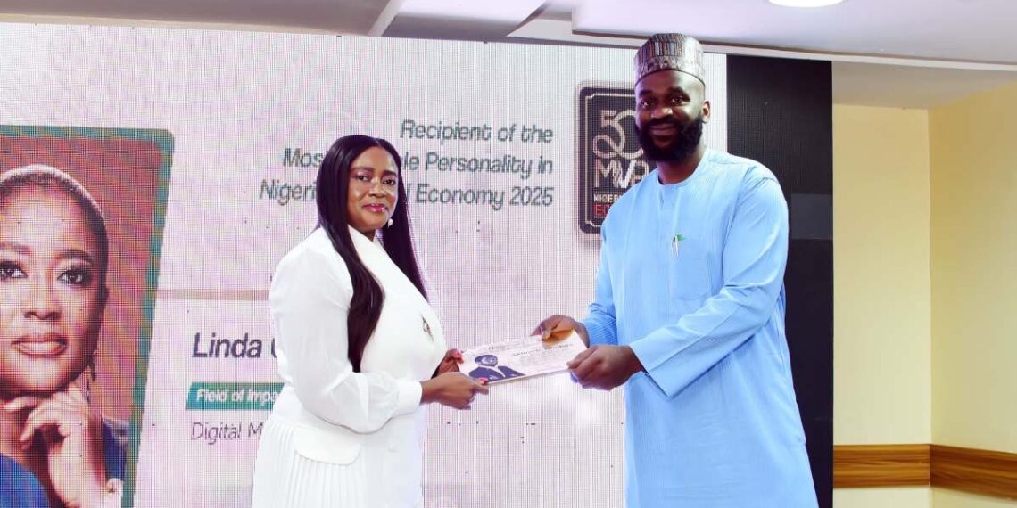 Linda Ochugbua receiving the 50MVPs award