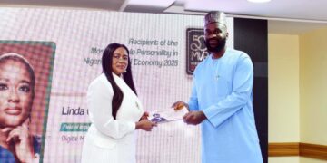 Linda Ochugbua receiving the 50MVPs award