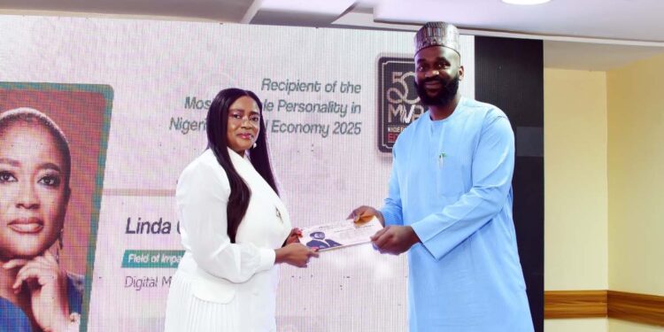 Linda Ochugbua receiving the 50MVPs award