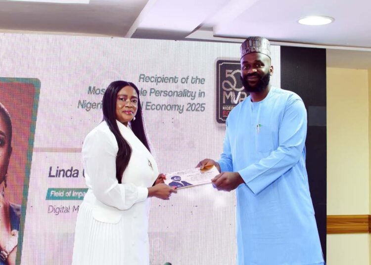 Linda Ochugbua receiving the 50MVPs award