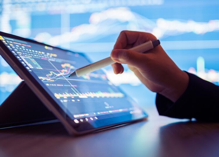 Crowdstrike outage - Woman looking stock market Data on smart phone