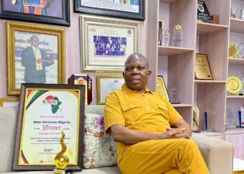 Tim Akano, the managing director, New Horizons Nigeria showcases the award