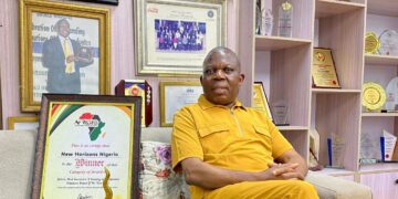 Tim Akano, the managing director, New Horizons Nigeria showcases the award